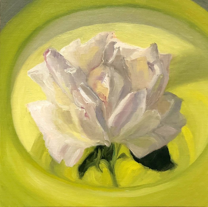 Rose in antique yellow glass bowl