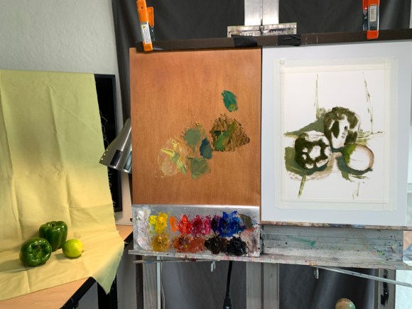 Setup and beginning of still life painting of green peppers